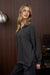 Side View Women’s casual half zip knit top in solid waffle pattern