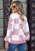 Cozy women’s pink sweater with geometric checkered pattern