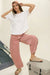 Soft cotton relaxed fit top styled with denim pants