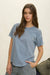 Short sleeve knit top exposed seams and relaxed drape fit