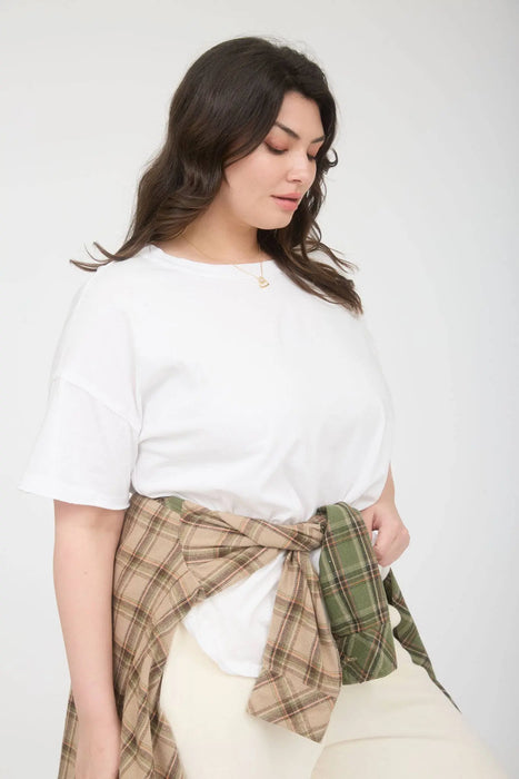 Plus size breathable cotton knit top styled with denim