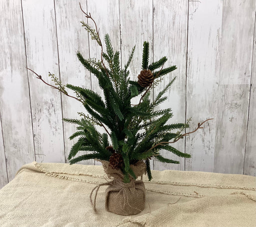 Close-up of artificial Austrian pine and eucalyptus mix with natural seed pods – high-end winter greenery from Heartland Store MN