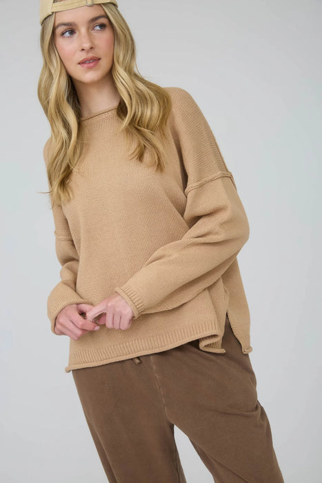 Tan raw edge long sleeve sweater with extended shoulders – women’s knitwear
