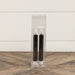 Close-up of black flameless taper candle showing realistic flame effect and elegant design