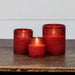 Close-up view of three red dotted glass texture on battery-operated flameless LED candles