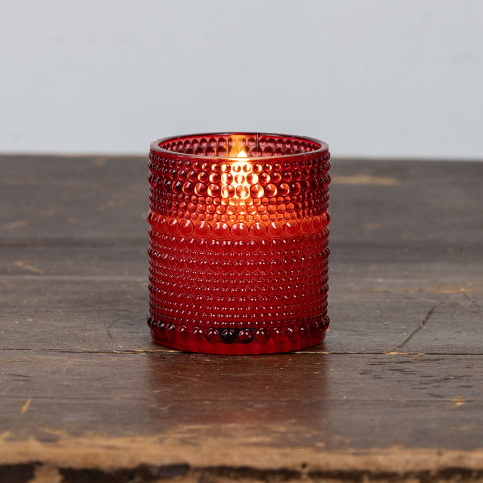 Red glass LED candle with dotted pattern perfect for vintage-style home decor