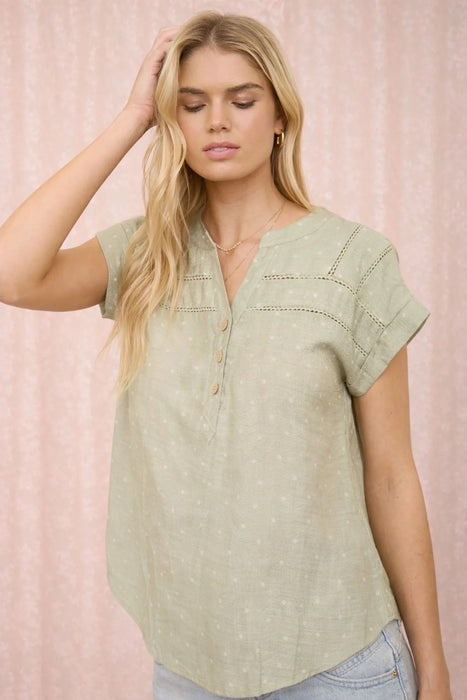 Short sleeve polka dot top styled with denim shorts
