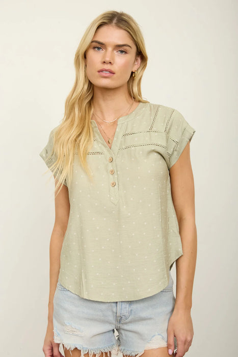 Polka dot Henley top with lace trim yoke detail front view