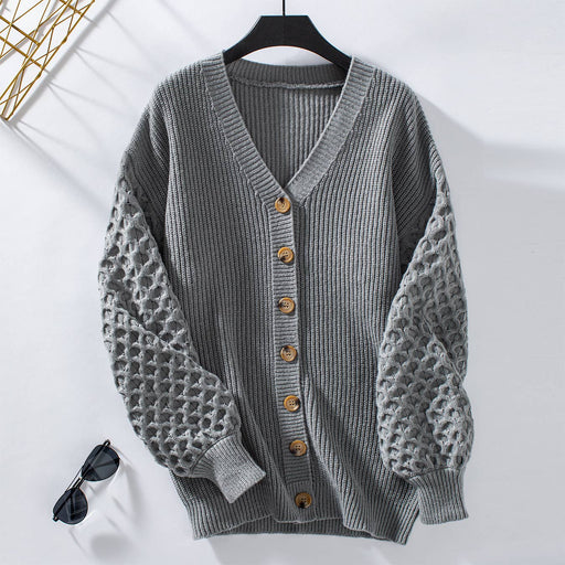 Cozy long sleeve grey knit cardigan with textured sleeves  styled for fall weather in Minnesota 