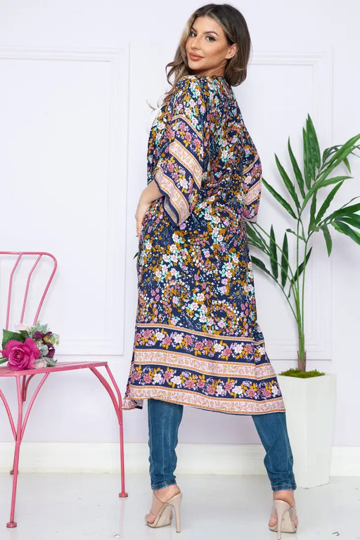 Women’s pink floral kimono layered over outfit