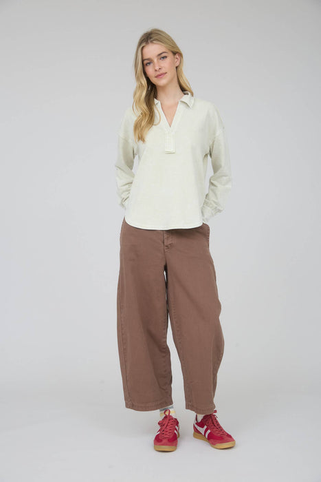 Drop shoulder long sleeve knit shirt with relaxed fit and U-shaped hem