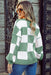 Green knit pullover with geometric checkered design and bishop sleeves