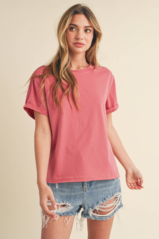 Woman wearing Mali Baby Tee short sleeve fitted top styled with casual denim shorts