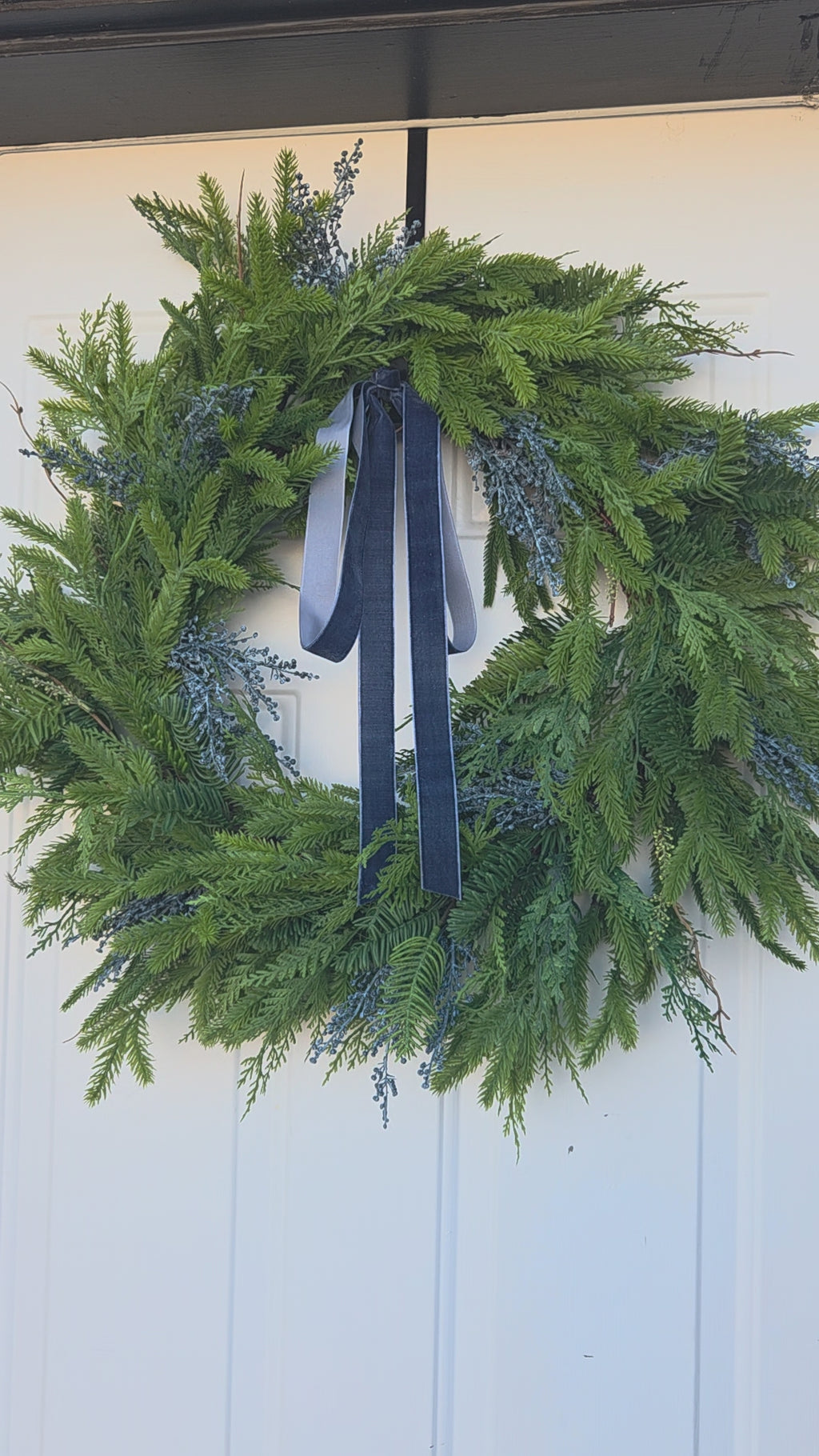 Mixed greenery front door wreath with trendy blue velvet accent – Rochester MN holiday home style