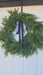 Mixed greenery front door wreath with trendy blue velvet accent – Rochester MN holiday home style
