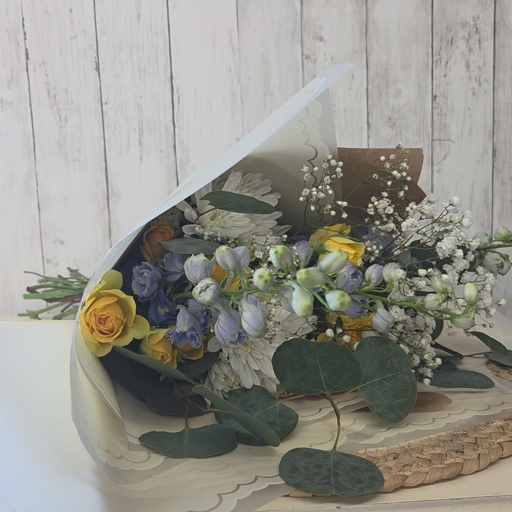 video of Fresh spring flower bundle with soft blue yellow and white blooms for birthday fresh flowers
