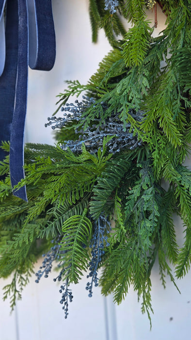 Outdoor greenery wreath with blue accents – perfect for Rochester MN homes