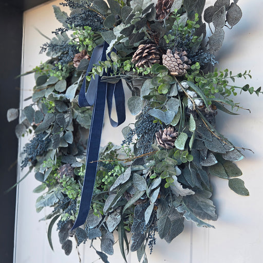 Outdoor front door wreath with blue berries and velvet bow – Lewiston MN home décor