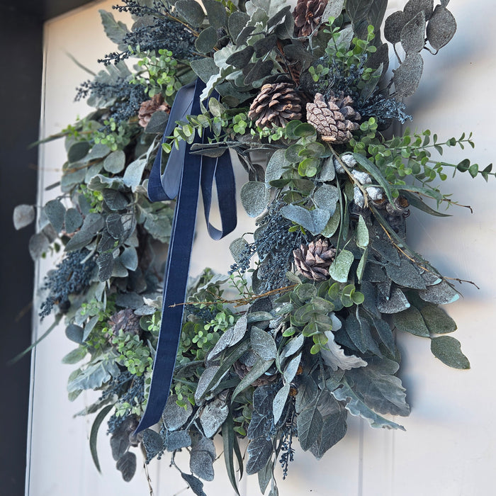 Outdoor front door wreath with blue berries and velvet bow – Lewiston MN home décor