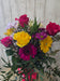 Close-up of yellow and lavender flowers with greenery in a seasonal vase arrangement from Heartland Store Minnesota