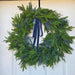 Elegant outdoor UV-treated Christmas wreath with blue berries and velvet ribbon – Winona MN decor