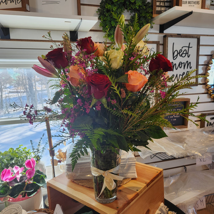Luxe large fresh flower arrangement in a crystal vase with roses and lilies at Heartland Store MN