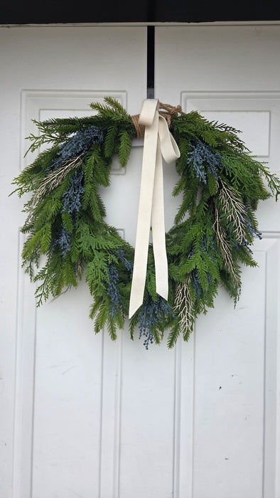 Artificial swag wreath with blue accents – Rochester MN front porch holiday look
