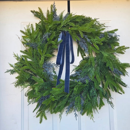 Trendy 28-inch mixed spruce and pine wreath with blue velvet ribbon – Heartland Store MN