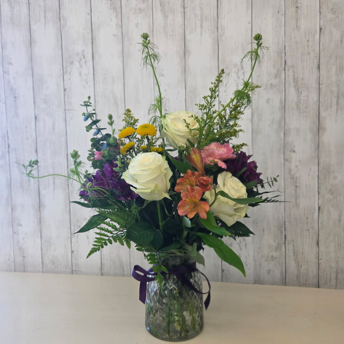 Handcrafted floral arrangement with mixed textures and eucalyptus available for local pickup and delivery at Heartland Store MN