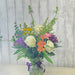 Close-up of fresh roses and carnations in a mixed color flower arrangement from a Minnesota gift and flower shop