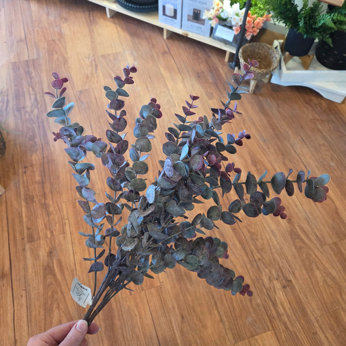 Artificial burgundy greenery bundle styled in farmhouse entryway