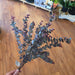 Artificial burgundy greenery bundle styled in farmhouse entryway