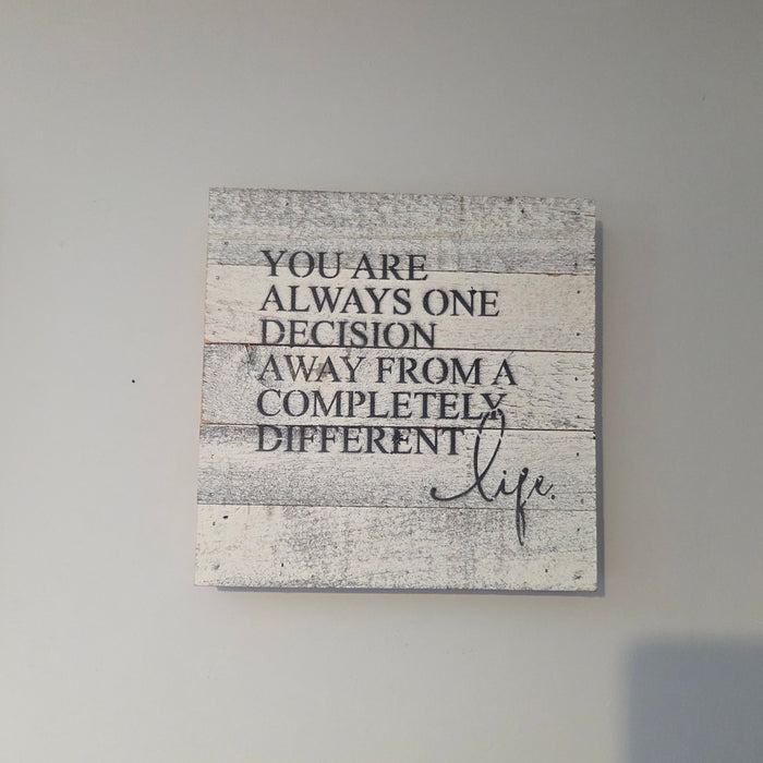 Inspirational wooden sign with one decision away quote