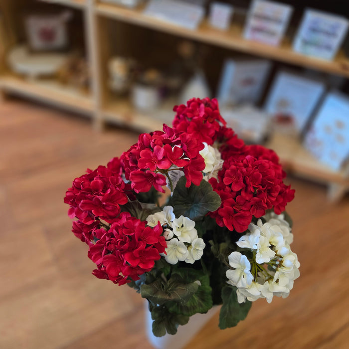 Red and white silk flowers for Memorial Day cemetery display