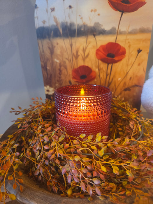 Red glass flameless candle showing realistic 3D flame simulation for safe home lighting