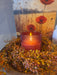 Red glass flameless candle showing realistic 3D flame simulation for safe home lighting